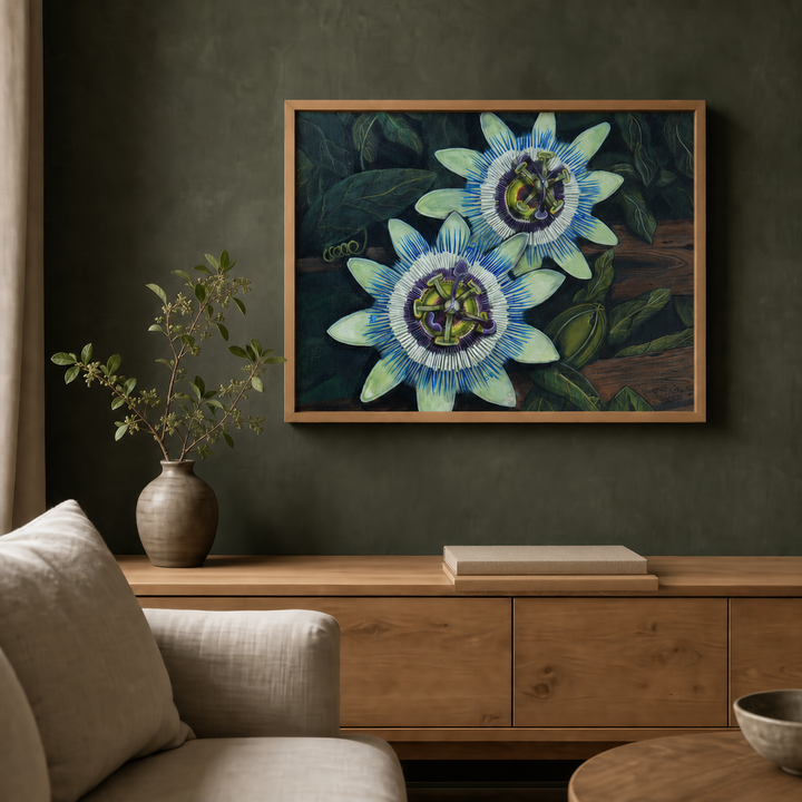 Fueled by Passion passion flower fine art print in a natural oak frame above a warm oak credenza in a refined dark-green living room.
