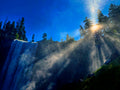 Sunbeams shining through mist above Vernal Fall in Yosemite